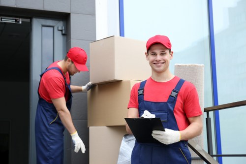 Man and van service with items being loaded for transport