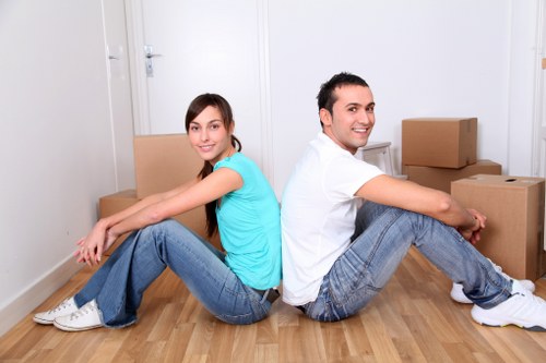 Experienced movers carrying furniture during a house removal in Vauxhall